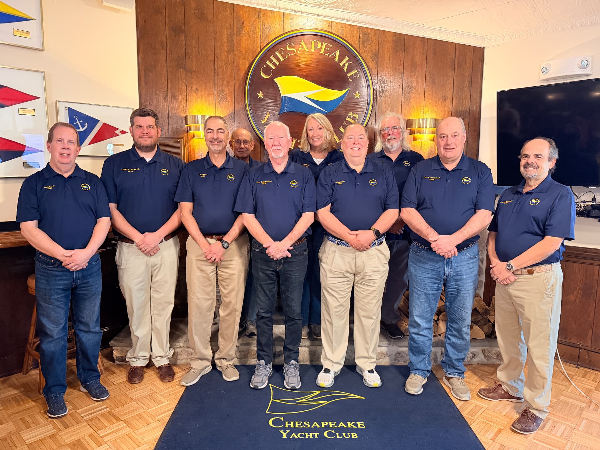 Chesapeake Yacht Club officers and Board of Governors beneath the club burgee crest