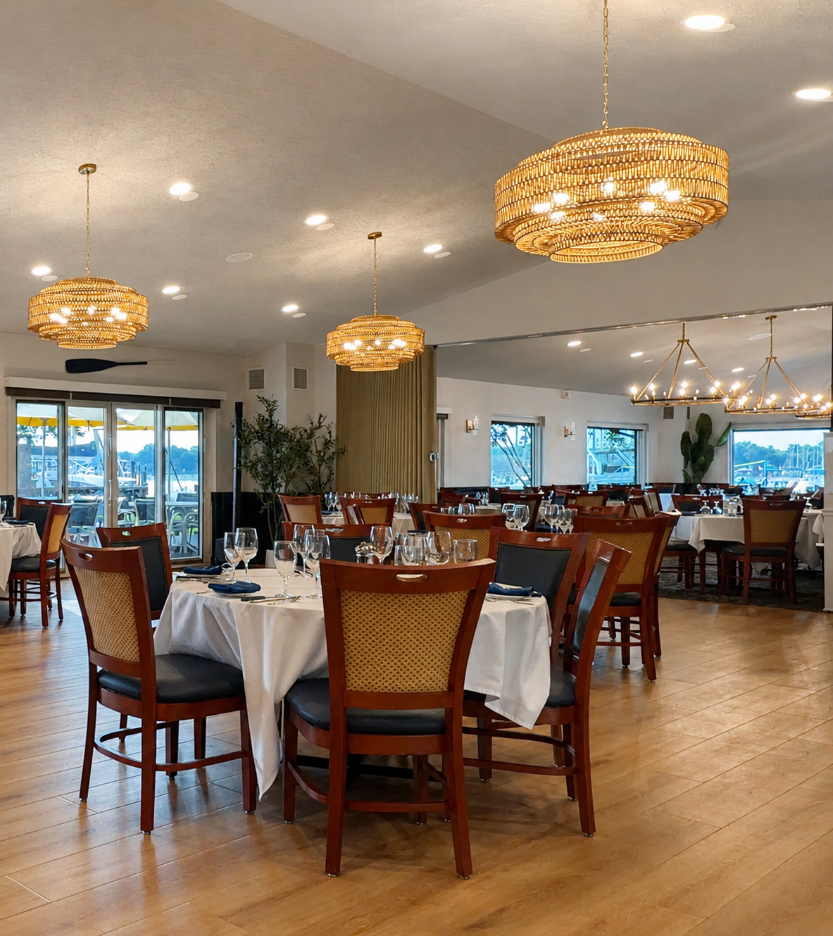 Chesapeake Yacht Club dining room with woven chandeliers and marina views